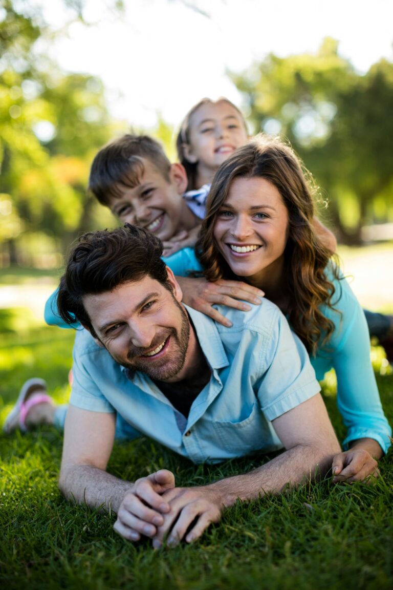 Portrait of happy family playing in park